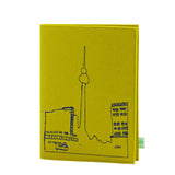 Nahaufnahme der weichen Wollfilz-Oberfläche des Skizzenbuchs.